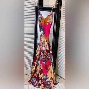 Beautiful flowered long dress with lining . Adjustable straps. Slit .